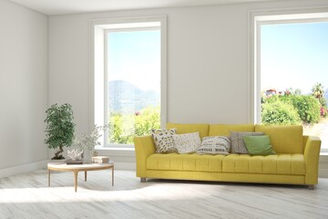 Fototapeta premium White living room with sofa and summer landscape in window. Scandinavian interior design. 3D illustration