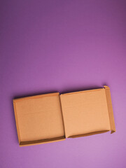 Eco friendly pizza box on a purple studio background