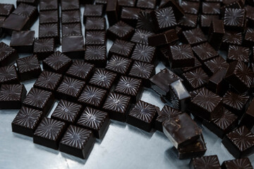 Chocolate in candy mold at confectionery shop. Chocolate candy making