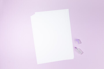 Obraz na płótnie Canvas empty white paper sheet on purple background. Mockup