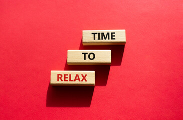 Time to relax symbol. Concept word Time to relax on wooden blocks. Beautiful red background. Business and Time to relax concept. Copy space