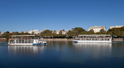 Boats in Guadalquivir river, Seville, Andalusia, Spain
