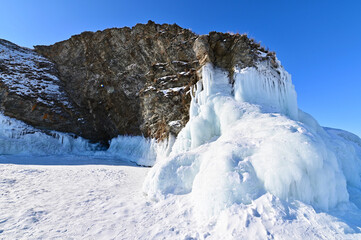 Rock Cliffs Covered with Ice Formations on Frozen Lake Baikal