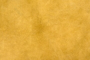 Brown suede cut as background textured and wallpaper. Rustic style leather