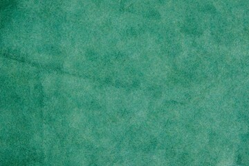 Green suede cut as background textured and wallpaper. Rustic style leather