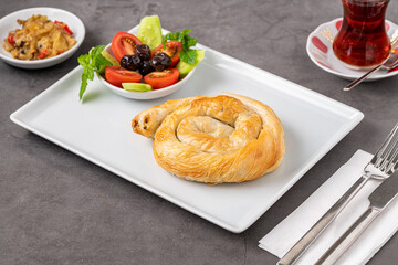 Traditional Turkish pastry made with spinach and cheese wrapped in phyllo. Turkish name gul boregi or gul borek