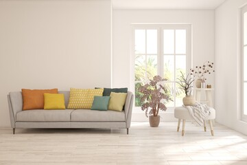 White living room with sofa and summer landscape in window. Scandinavian interior design. 3D illustration