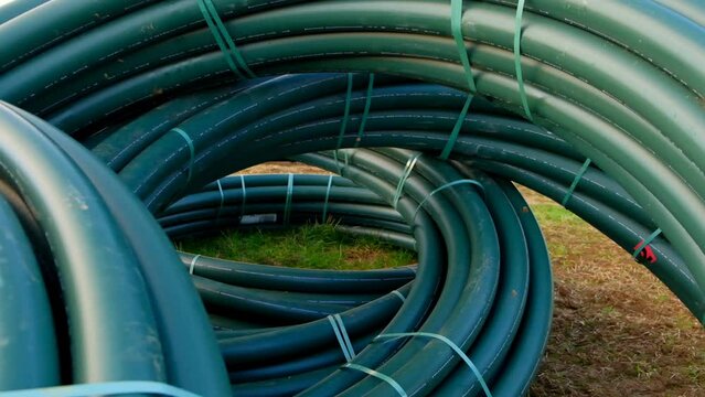 water pipes set.Plumbing plastic flexible pipes in rolls.Plumbing installation.Pipe laying. Bringing water to the house. High quality 4k footage