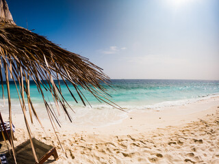 Fototapeta na wymiar amazing tropical beach background white sand and clear blue water