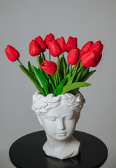 a bouquet of red tulips on a white background