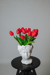 a bouquet of red tulips on a white background