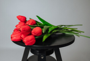 a bouquet of red tulips on a white background