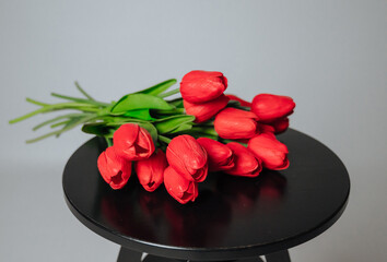 a bouquet of red tulips on a white background