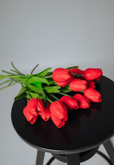 a bouquet of red tulips on a white background