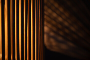 a wooden lamp shines on the table