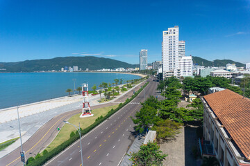 View of Quy Nhon city with a beautiful beach, long coastal route, clear blue sky, and high-rise hotels. Vietnam. Beautiful scenery in Vietnam	
