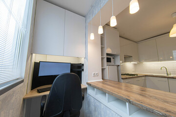 workplace on the balcony combined with the kitchen, bar counter table from the windowsill.