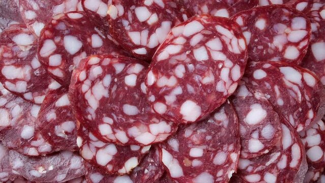 Sliced sausages close up, rotation