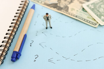 Concept image of person looking at money bills. Idea of business, finance and planning