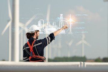 Engineers are controlling a wind turbine with AI technology for precision and accuracy with minimal errors. © Wosunan