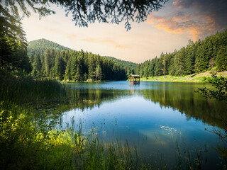 A wonderful view of the lake at sunrise. Shiin mountain lake in camping and picnic area. Spring season nature background