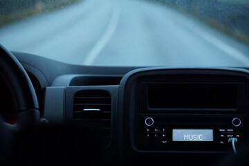 Obraz na płótnie Canvas Driving a car - perspective of a driver - bokeh effect