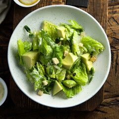 Healthy green salad with avocado