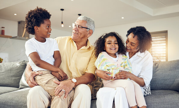 Grandparents, grandchildren and children with elderly people in a home bonding, playing and enjoying quality time together. Kids, grandmother and grandfather relax with grandkids for holiday