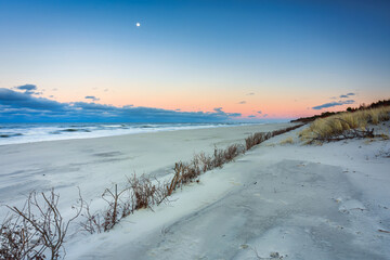 Beautiful Baltic sea beach on the Hel Peninsula at sunset. Poland