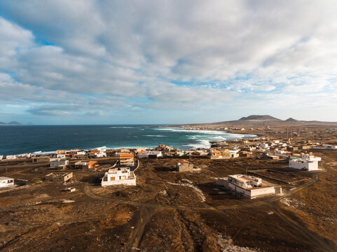 Aerial photos of Calhau, a village located near an inactive volcano in Sao Vicente Island, Cabo Verde, offer a unique perspective of the towering volcanic landscape, rugged terrain, and vibrant coasta