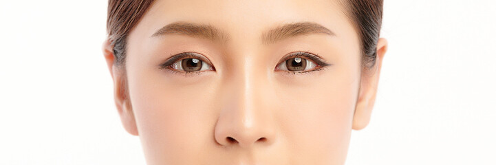 close up of beauty asian woman eye on white background.