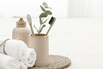 Spa composition with bamboo eco brushes on white background.