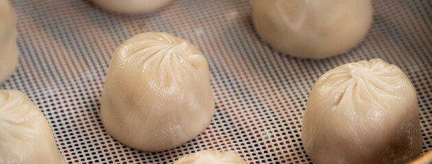 Steamed pork soup dumplings named Xiao long bao in Taiwan.