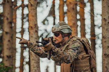 A modern warfare soldier on war duty in dense and dangerous forest areas. Dangerous military rescue...