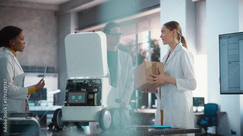 Fototapete Team of Industrial Specialists Working on Mobile Robot, Using a Laptop. Young Male and Female Engineers in a Lab Discussing an Automated AI Robotic Delivery Assistant, Brainstorming Improvement Ideas