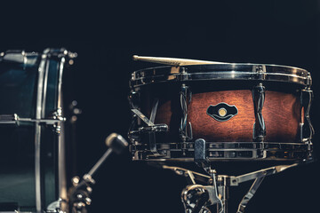 Obraz na płótnie Canvas Close-up, snare drum on a dark background isolated.