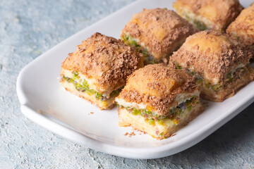 Traditional turkish new dessert cold milky baklava with pistachio (Turkish name; soguk baklava)