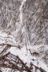 top down perspective of hiking trail during winter season, snow on the ground
