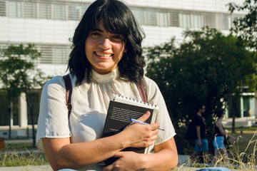 portrait of young venezuelan woman loving her university studies.