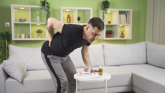 A man with a herniated disc, lifting heavy objects, staying in the same position for a long time.