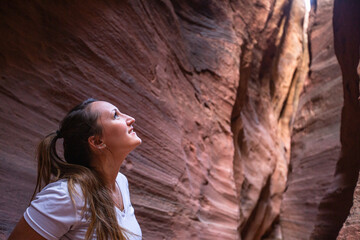 woman traveling looking up in canyons