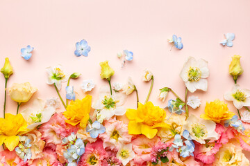 Spring Flowers composition on pastel pink background. Floral concept for Easter, Woman's day or...