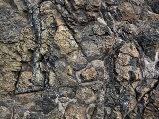 Stone background. Rock. A stone wall. Rough, untreated, natural stone. Rock formation. Natural background. Copy space
