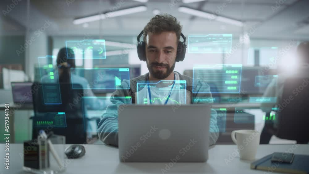 Fototapete Young Hispanic Male Software Developer Working in Technological Start-Up Office. Latin Specialist Programming Monitoring Solutions. VFX Hologram Animation Visualizing Interfaces, Opened Windows.