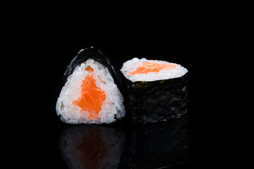Japanese maki sushi rolls with salmon, rice and nori.