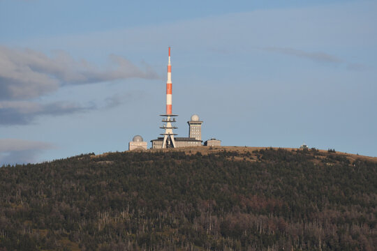 Radio tower and buildings on the Brocken mountain top under the blue sky in the Harz mountains