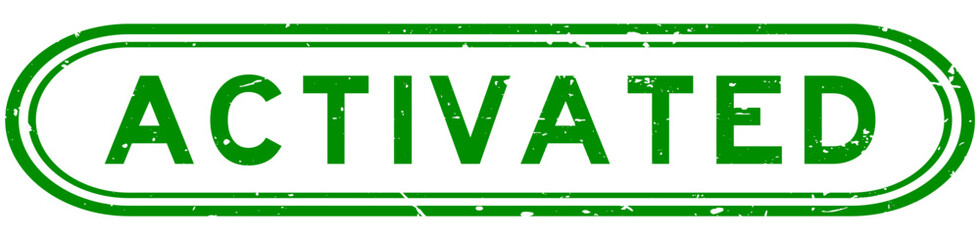 Grunge green activated word rubber seal stamp on white background