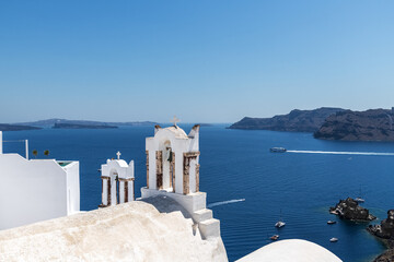 White bell towers on the island of Santorini. Greece