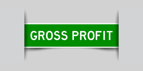 Inserted green color label sticker with word gross profit on gray background