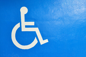 wheelchair symbol in white on a blue background for garage spaces accessible to people in...